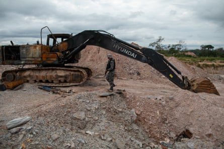 A charred excavator at the Garimpo Quatro site.Photograph: João Laet/The Guardian