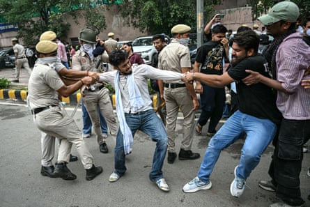CJP supporters clash with police during the march.Photograph: Sajjad Hussain/AFP/Getty Images