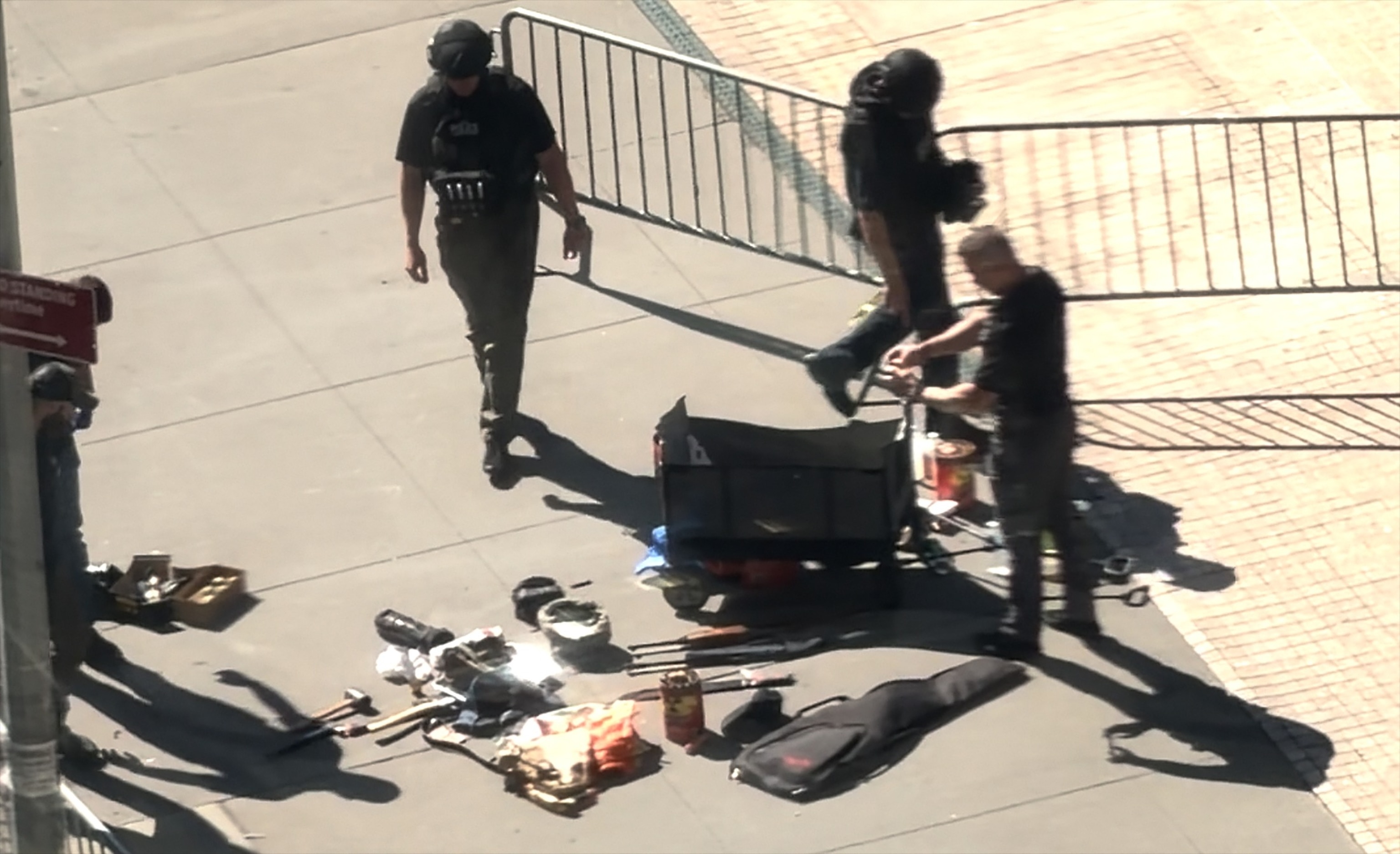 Law enforcement search though items left behind after a man with a history of anti-Immigration and Customs Enforcement (ICE) activity set off an "incendiary device" outside a federal building in Manhattan on July 20, 2026, authorities said.Obtained by ABC News