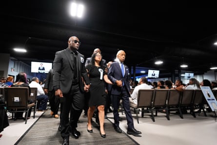 Christine Wonsley walks with her husband Elmore and the Rev Al Sharpton during a memorial service for Nolan Xavier Wells.Photograph: Gerald Herbert/AP