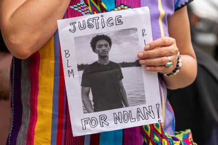 A person holds a placard that reads ‘Justice for Nolan’ in Manhattan, New York City.Photograph: David Dee Delgado/Reuters