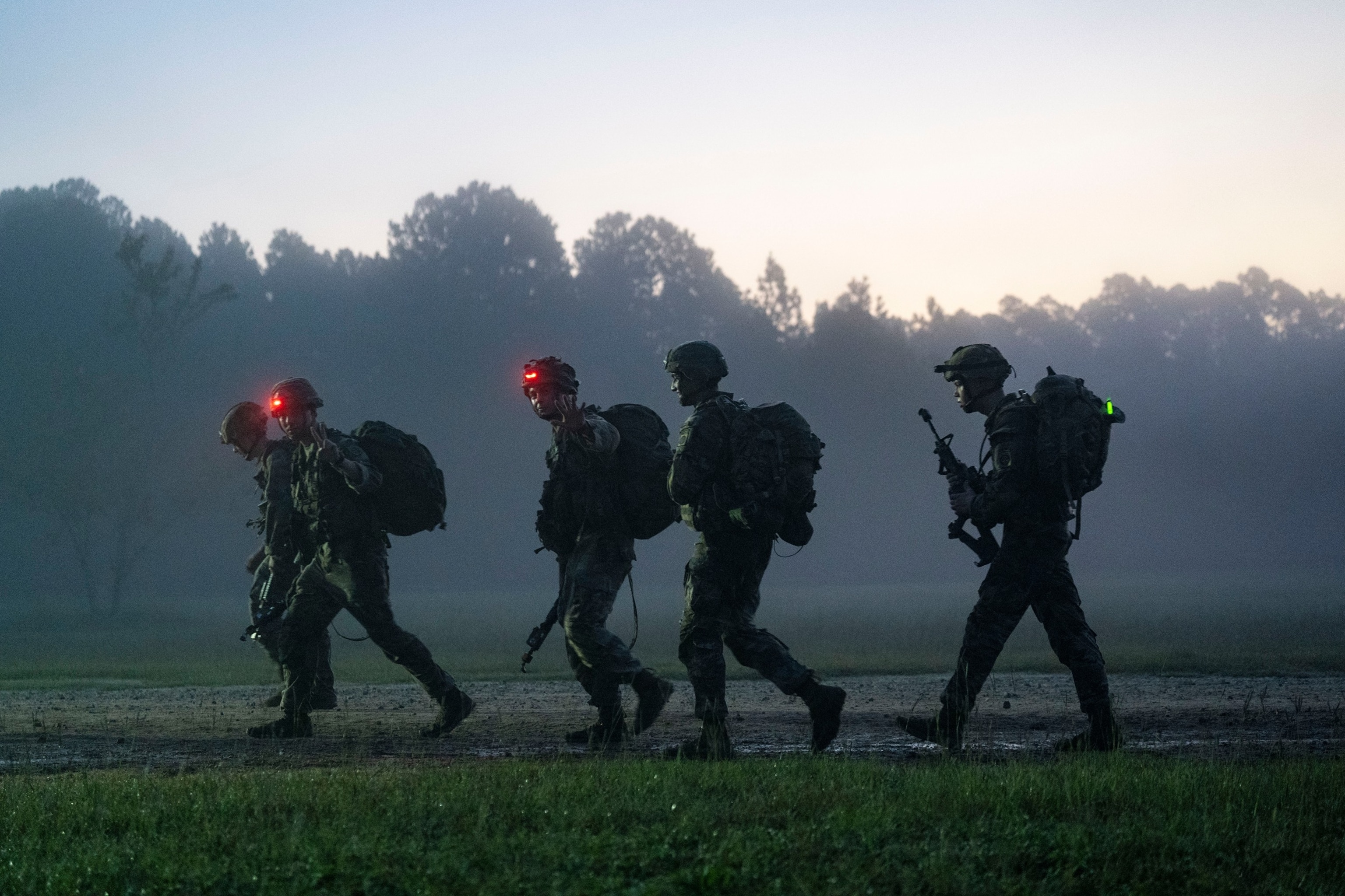 Paratroopers assigned to the 82nd Airborne Division, walk the final mile of the 12-mile ruck march during E3B on Fort Liberty, North Carolina, Sept. 21, 2024.U.S. Army