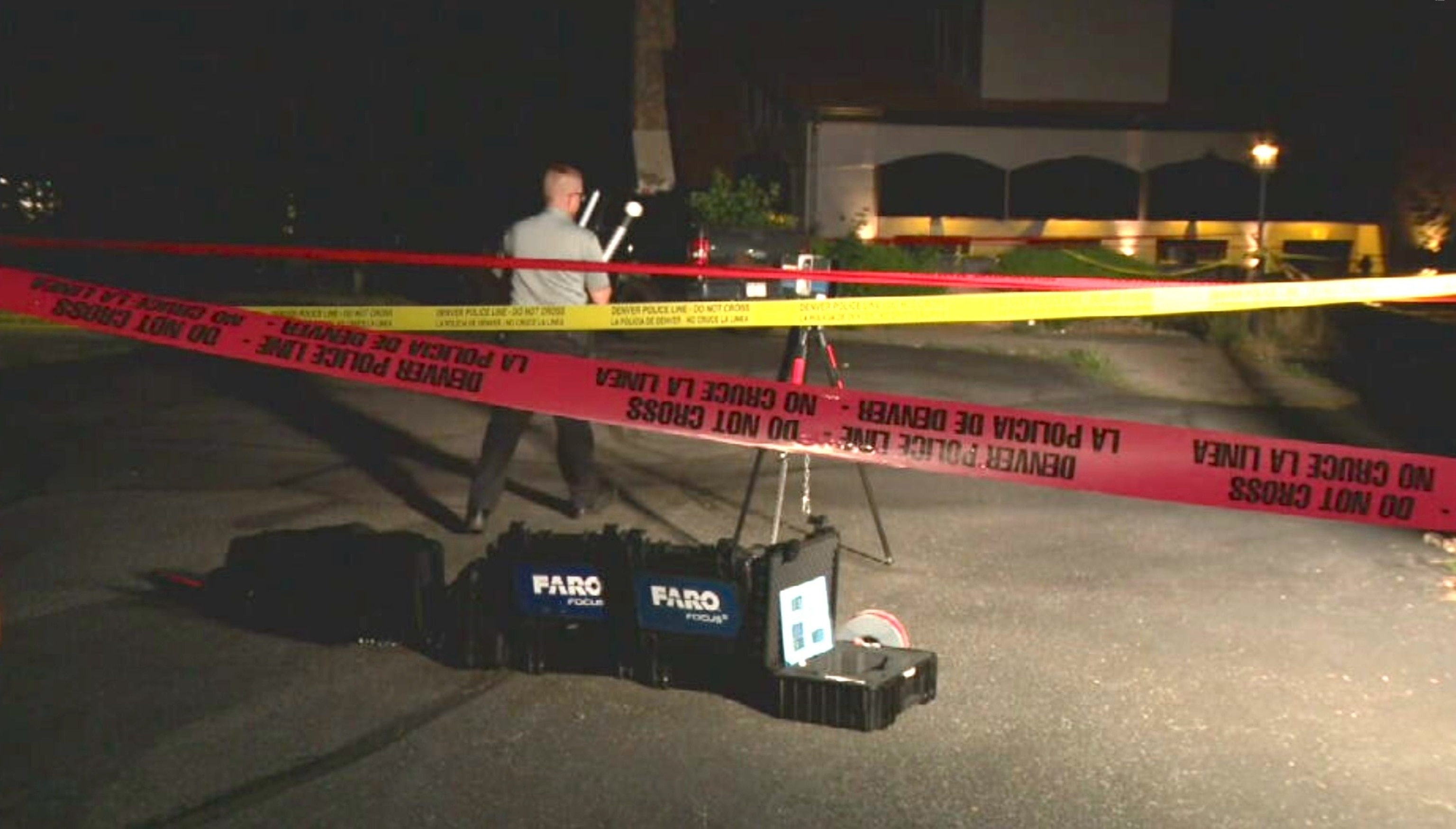 Police investigate a shooting that occurred, July 20, 2026, in the parking lot of the Ultra Lounge nightclub in Denver that left one person dead and eight injured.KMGH