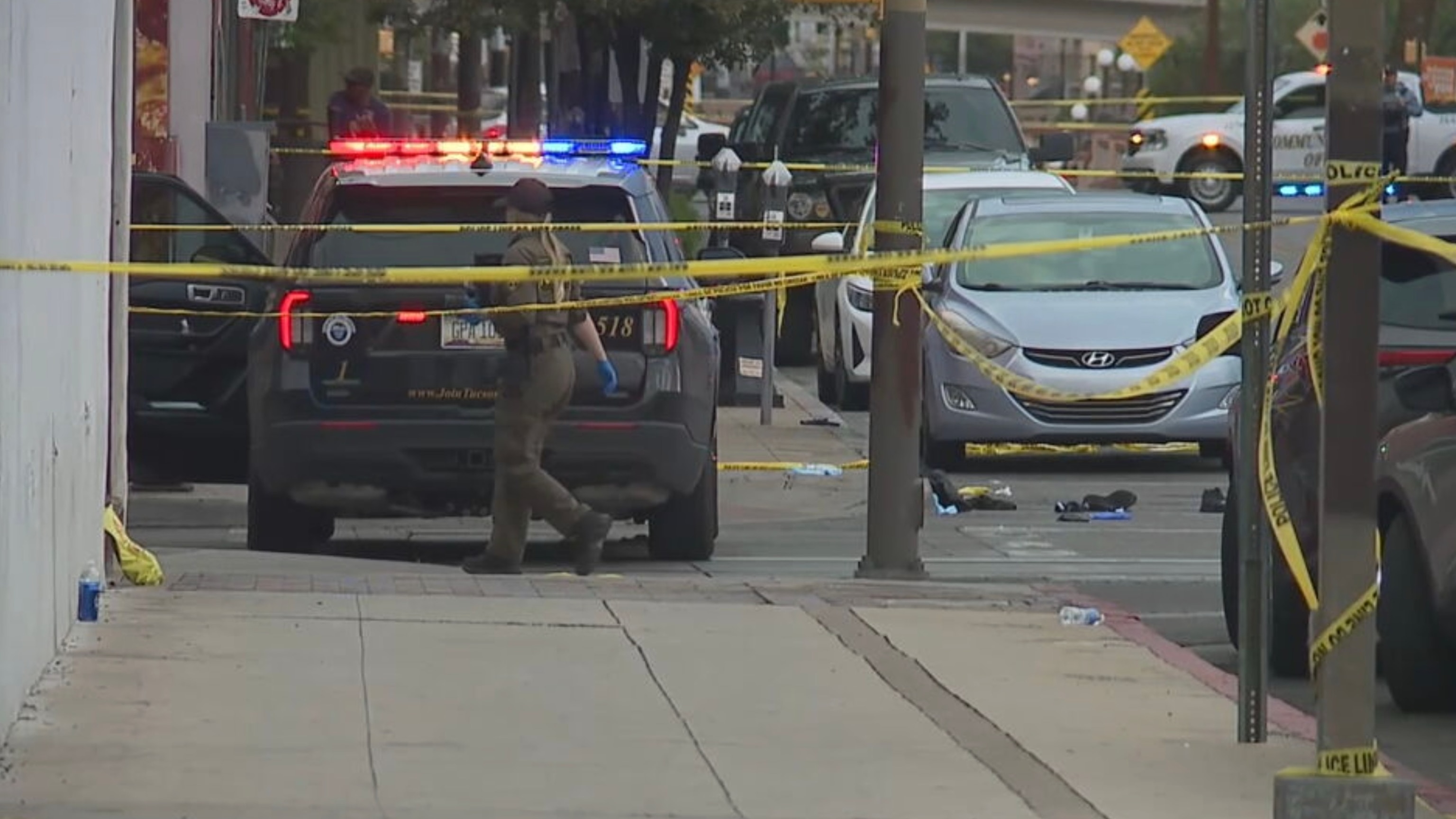 Police investigate a shooting in downtown Tucson, Arizona, July 19, 2026, that left nine victims injured. The suspected gunman was shot by officers, who were on foot patrol when the gunfire broke out.KGUN