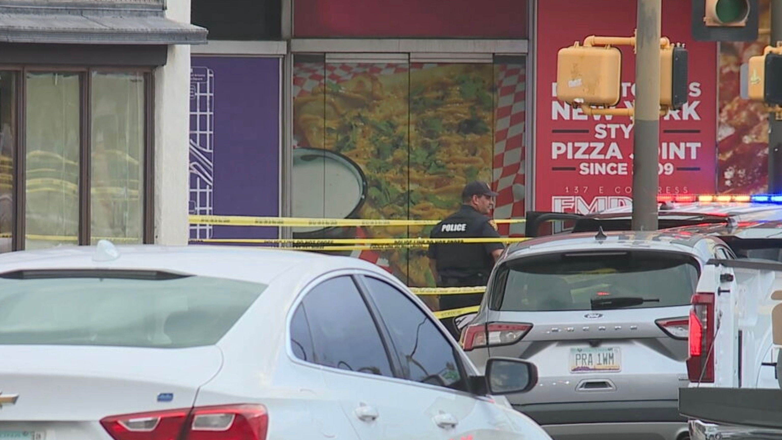 Police investigate a shooting in downtown Tucson, Arizona, July 19, 2026, that left nine victims injured. The suspected gunman was shot by officers, who were on foot patrol when the gunfire broke out.KGUN