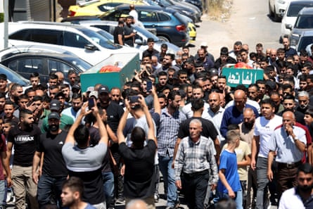 The funeral of Awda Abulrahim Farajna and Ahmed Adil Abu Muhu on Monday.Photograph: Anadolu/Getty