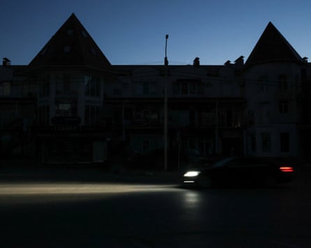 A dark street during a power outage in Yevpatoria.Photograph: Alexey Pavlishak/Reuters