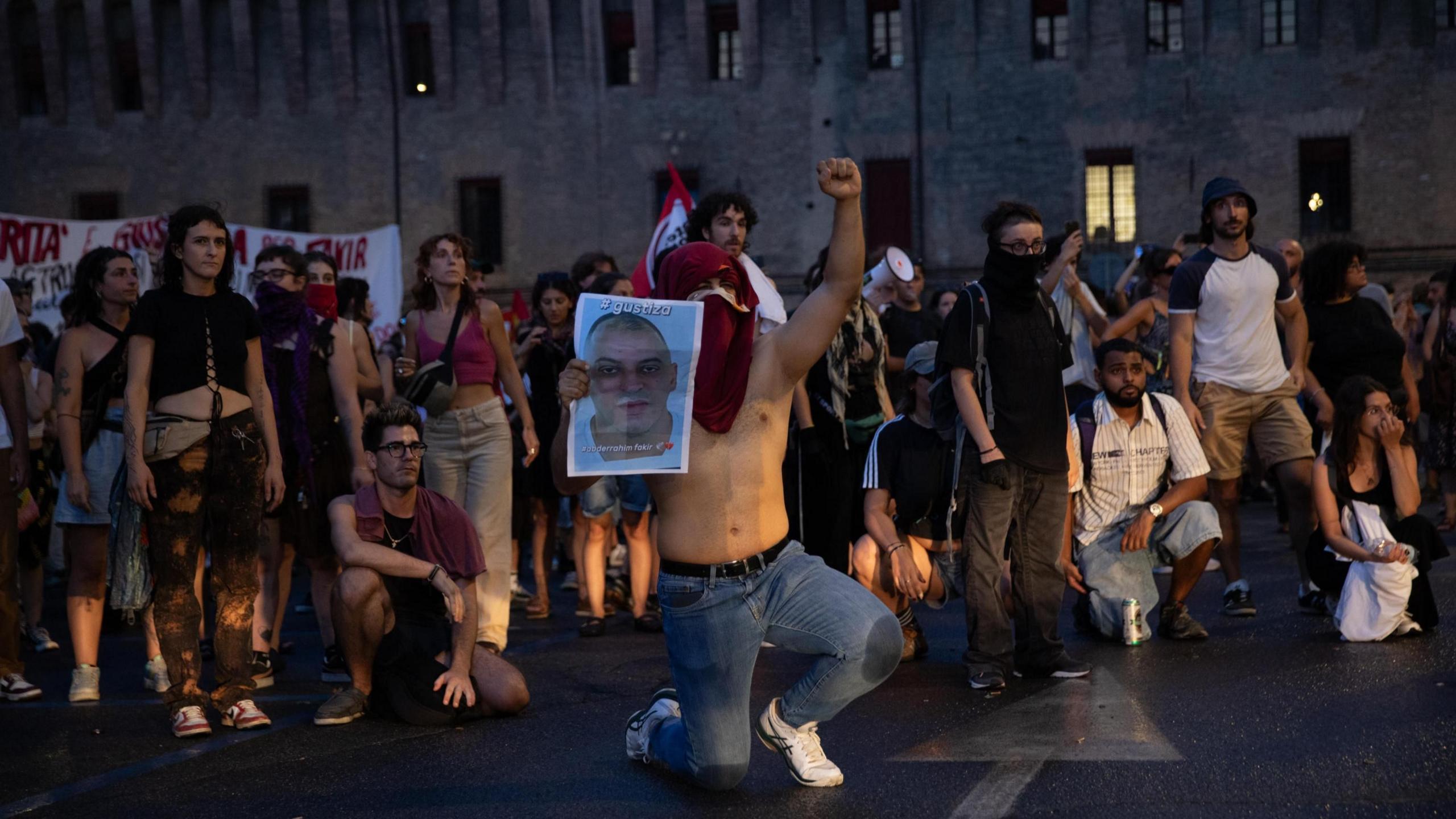 Image caption,About 100 protesters ended up clashing with police setting two cars alight