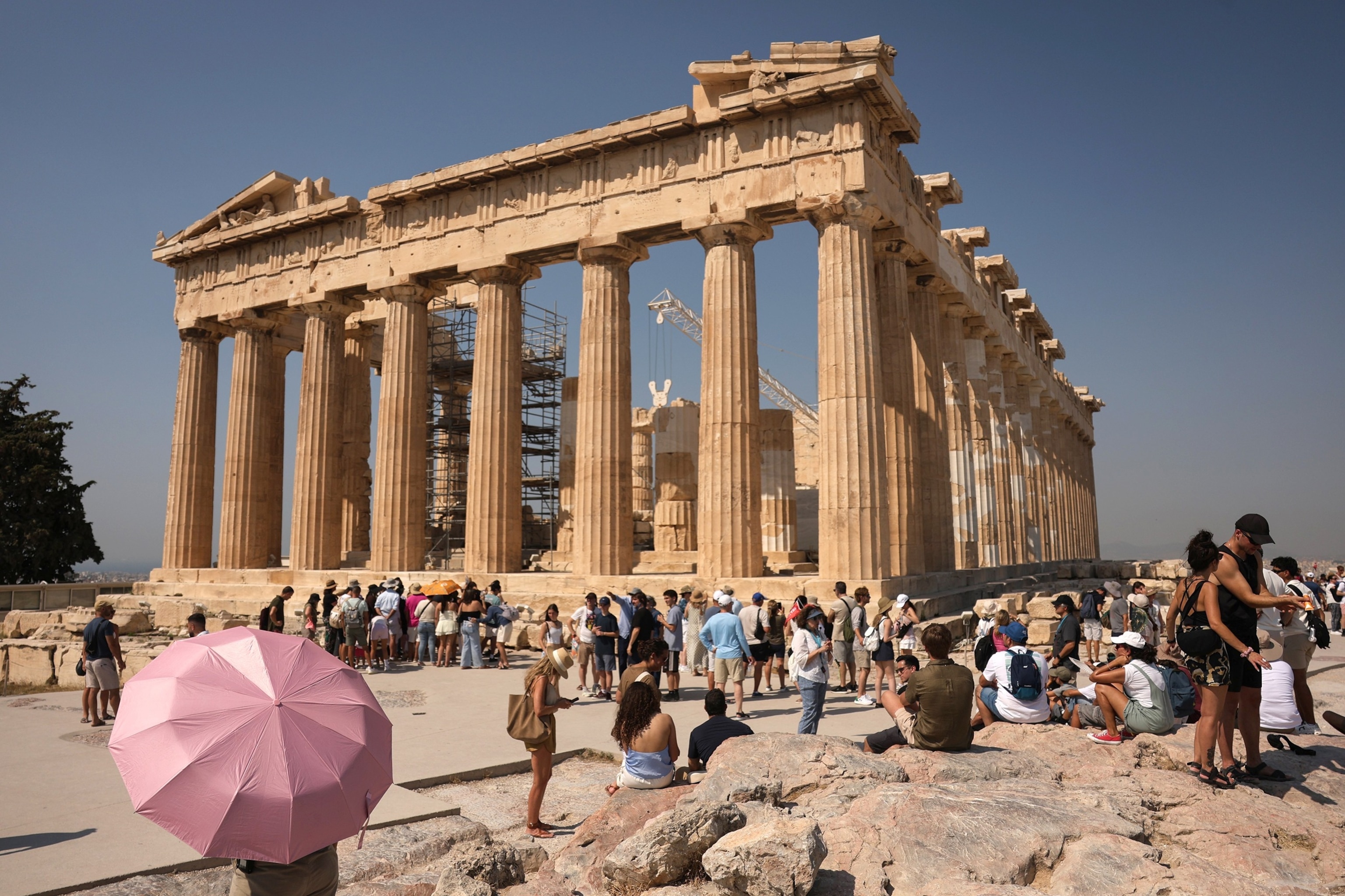 Tourists visit the Acropolis during a heatwave in Athens, Greece, July 21, 2026.George Vitsaras/EPA/Shutterstock