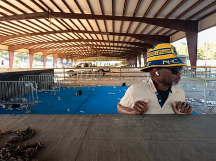 Donal Gooch leans against the stage at the events arena he founded in Eagle Rock, North Carolina.Photograph: Dare Coulter