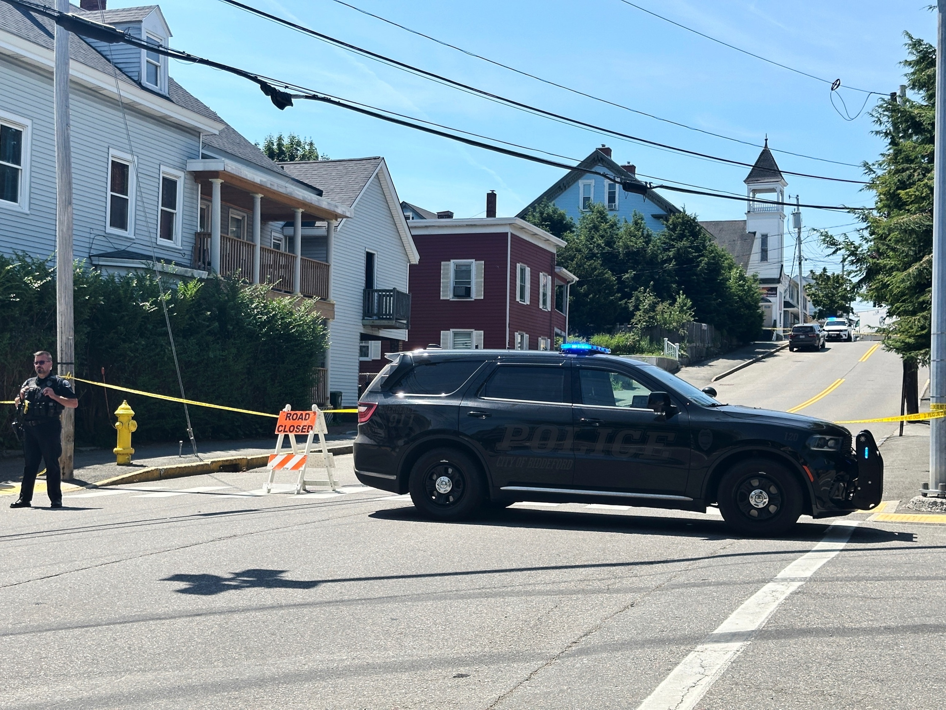 Police block a road after a shooting in Biddeford, Maine, July 13, 2026.Patrick Whittle/AP