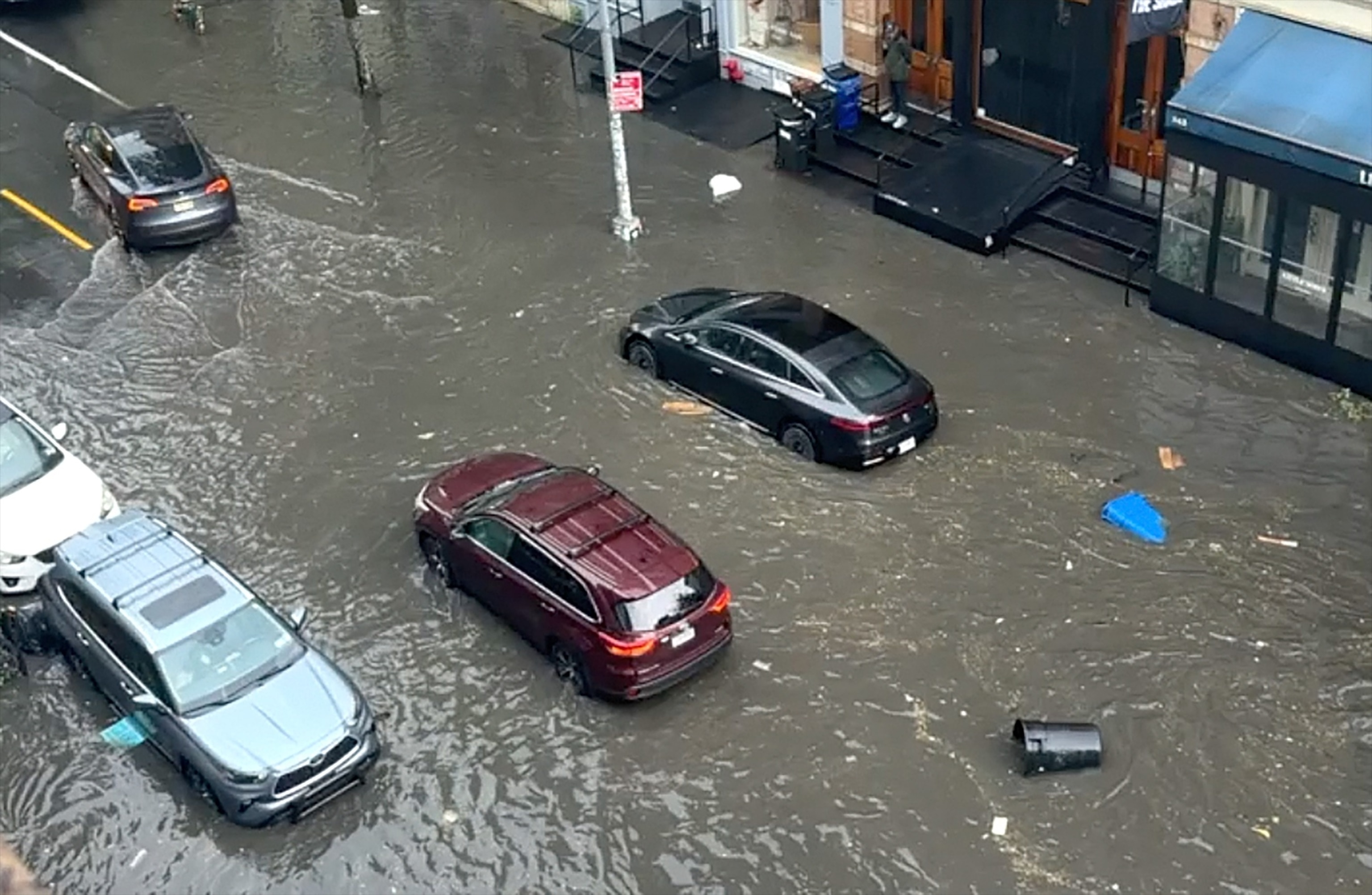 Cars drive through a flooded street in Soho during a thunderstorm in New York City, July 18, 2026.PersianPoet/nstagram