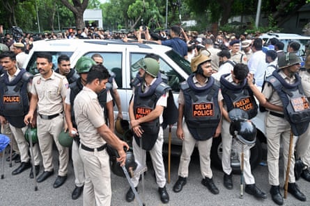Police detaining Priyanka Gandhi outside the prime minister’s residence in Delhi.Photograph: Ritesh Shukla/Getty Images