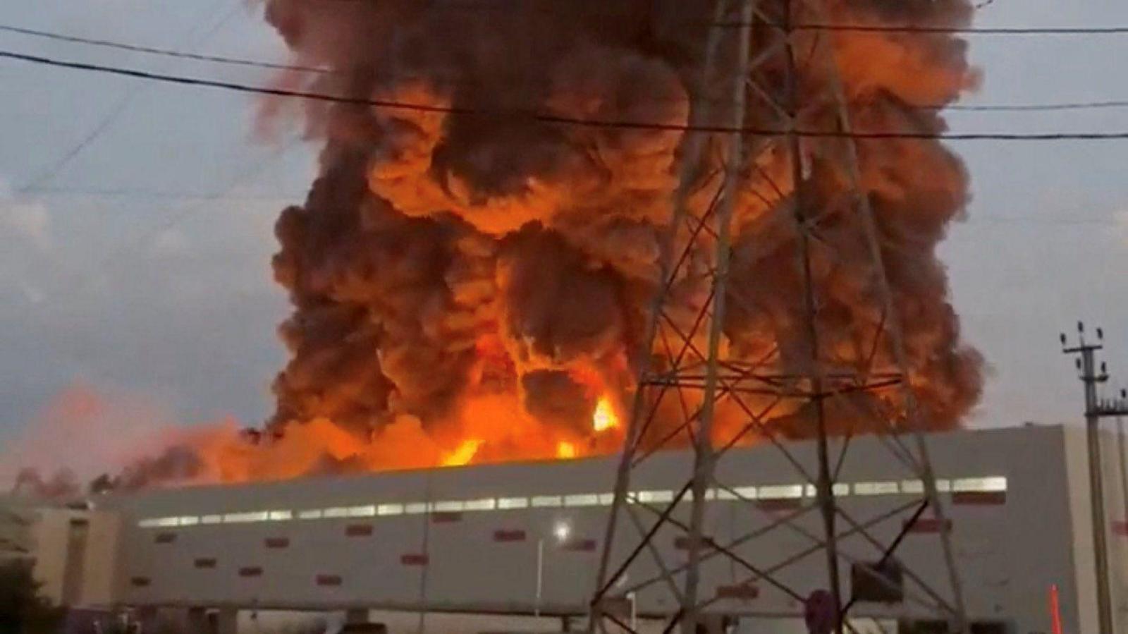 Image caption,A still taken from a social media video verified by Reuters shows smoke rising above a warehouse