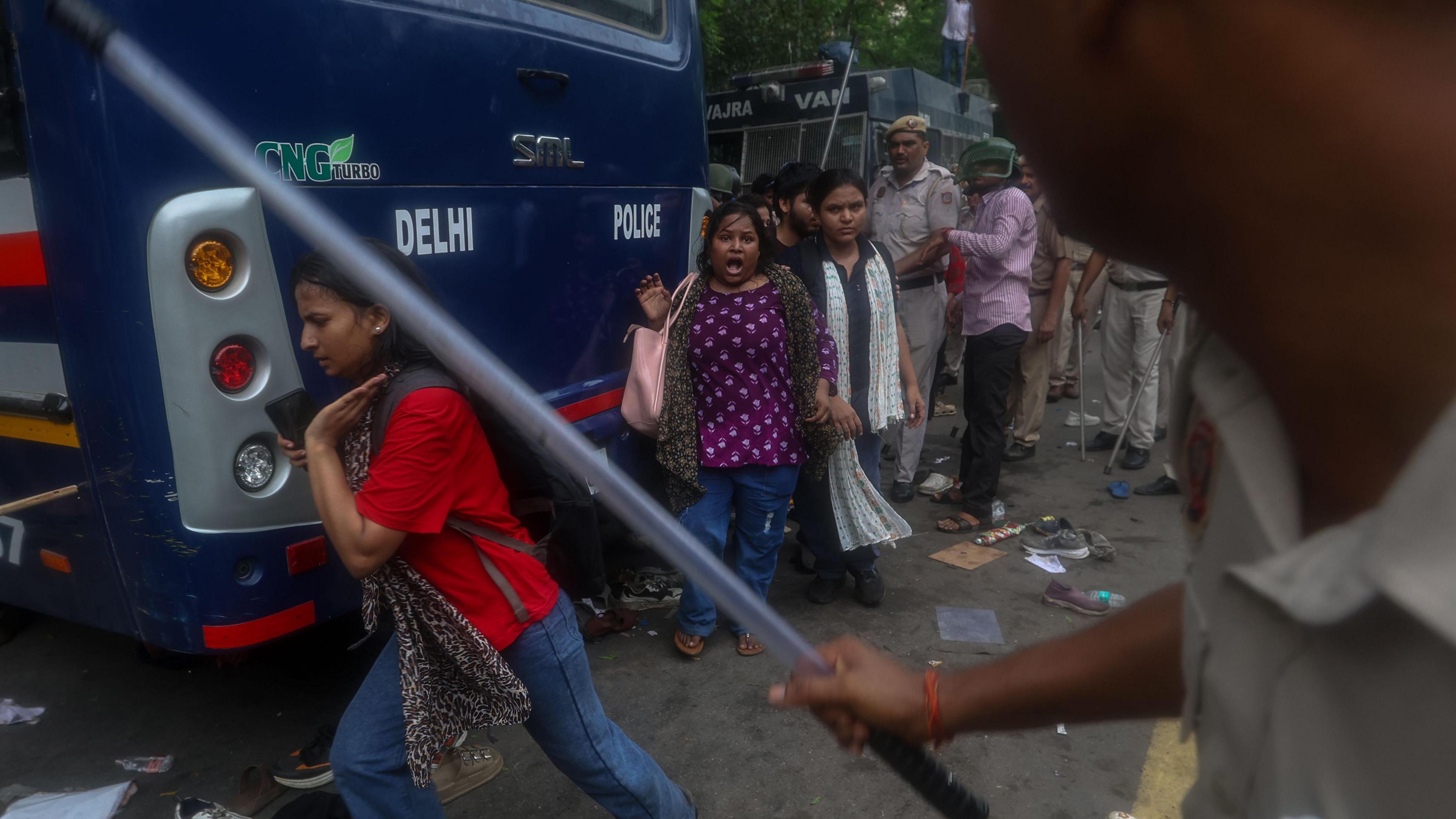 Image caption,Police used force, including batons and tear gas, to disperse protesters