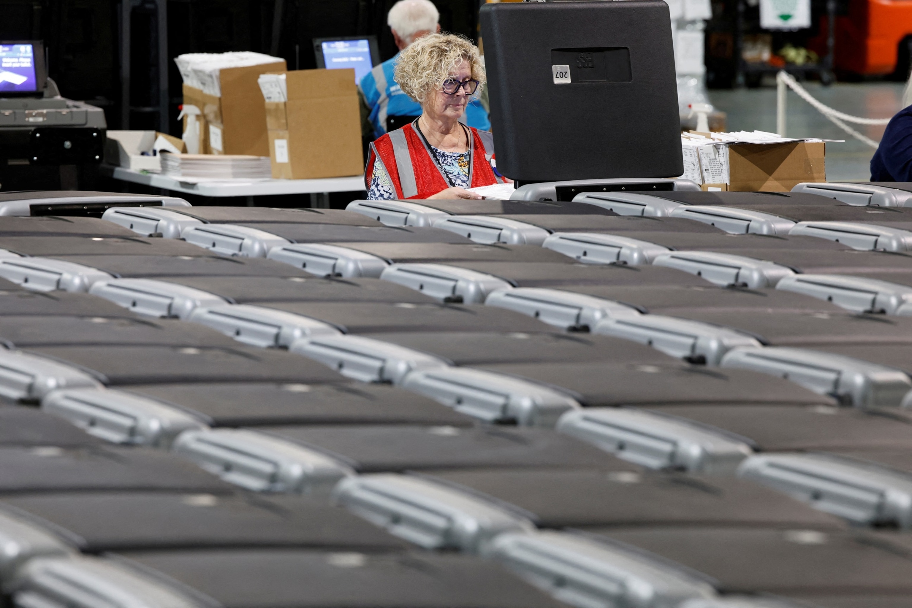 A precinct official performs logic and accuracy testing on voting machines ahead of the upcoming general election, at Wake County Board of Elections headquarters in Raleigh, N.C. Sept. 5, 2024.Jonathan Drake/Reuters, FILE