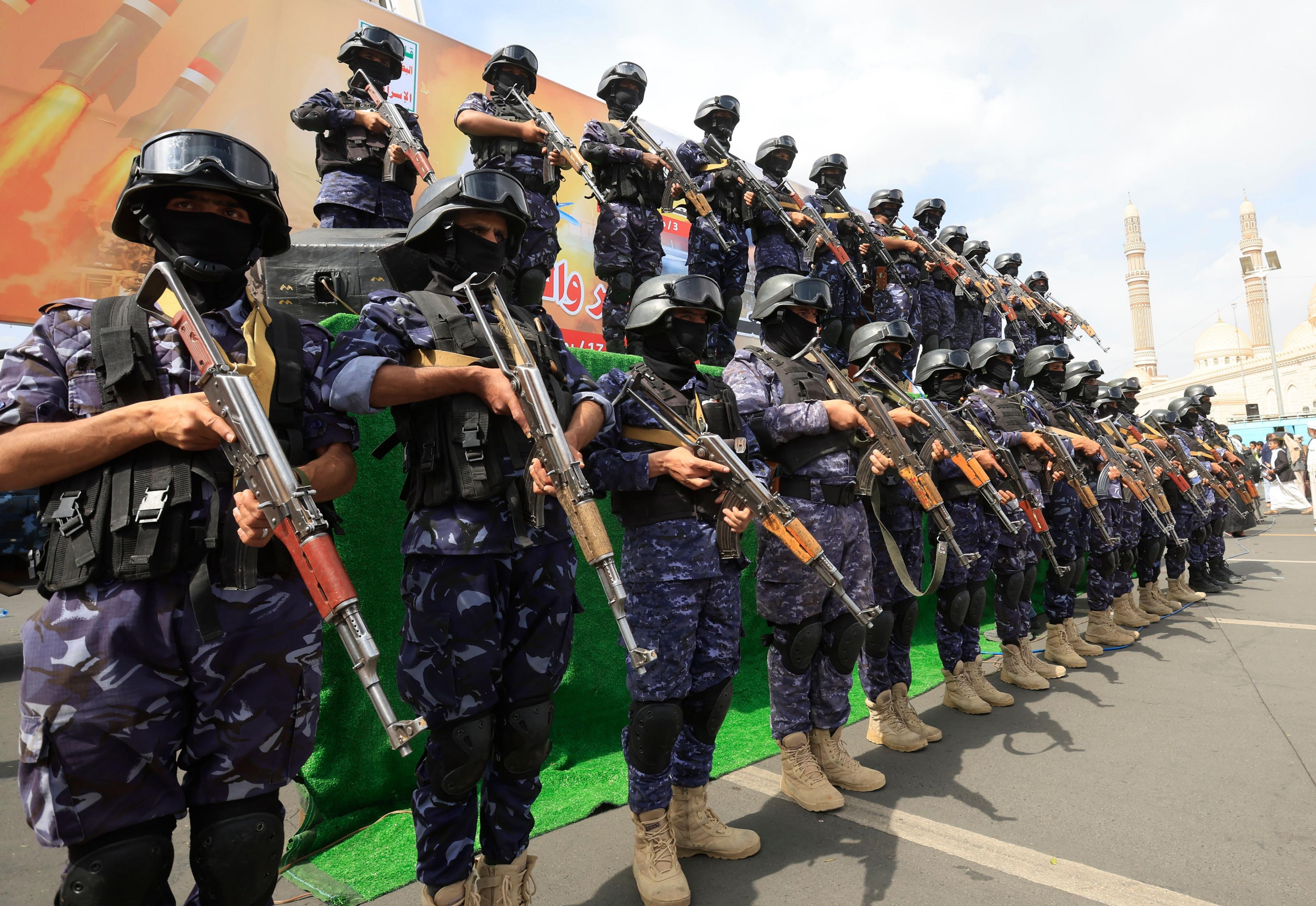 Image caption,Houthi fighters during a protest against Saudi Arabia in Yemen's capital Sana'a on 17 July