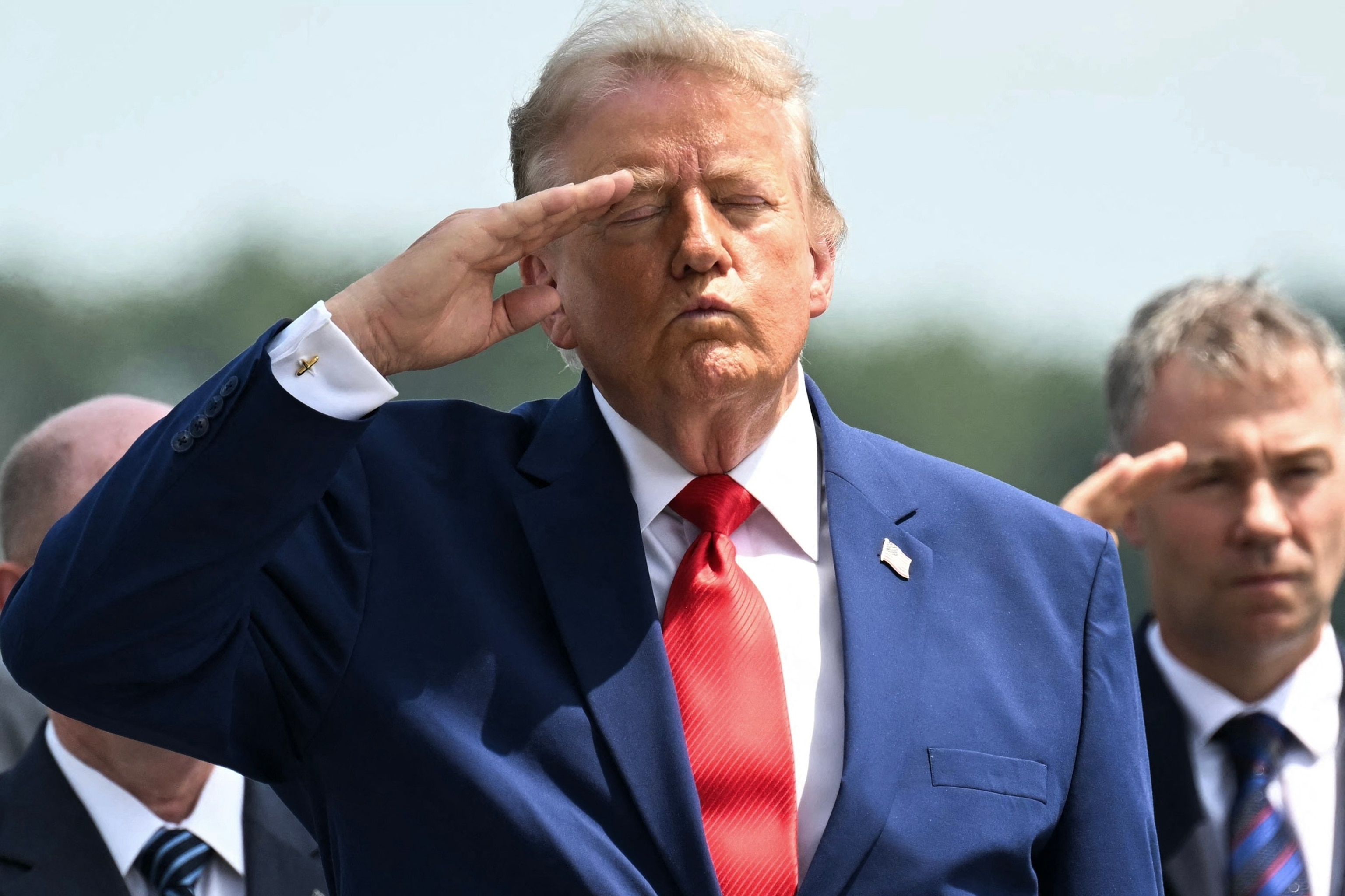 President Donald Trump salutes during a dignified transfer solemn event for US service members killed during operations in the Middle East, at Dover Air Force Base in Dover, Delaware, July 22, 2026.Saul Loeb/AFP via Getty Images