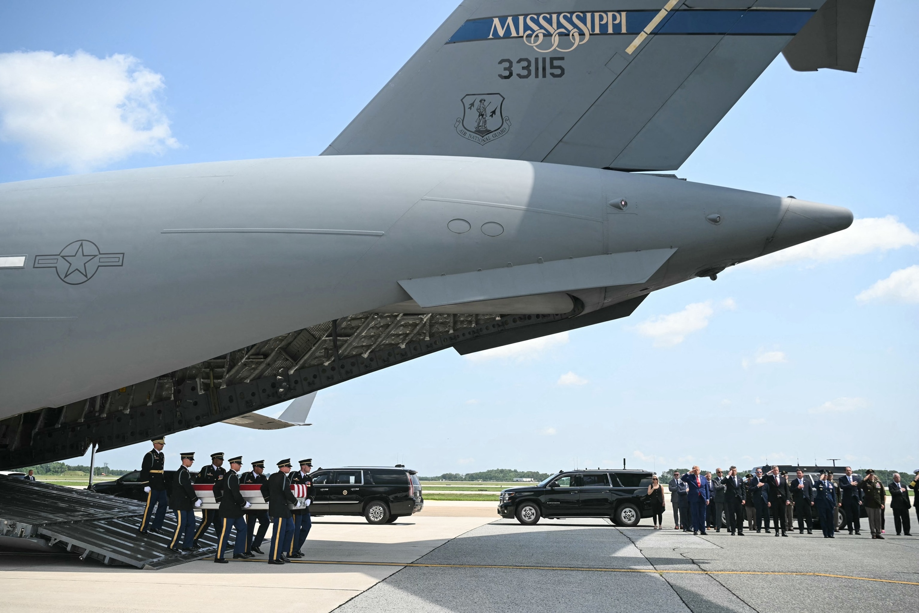 President Donald Trump and Secretary of Defense Pete Hegseth salute as a U.S. Army carry team moves a transfer case containing the remains of 1st Lt. Tyler James Feehan of Ewa Beach, Hawaii, July 22, 2026, at Dover Air Force Base, Del.Saul Loeb/AFP via Getty Images