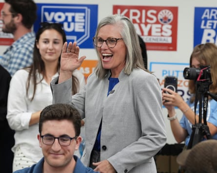 Katie Hobbs waves to campaign volunteers as voters cast their ballots on primary election day in Phoenix.Photograph: Ross D Franklin/AP