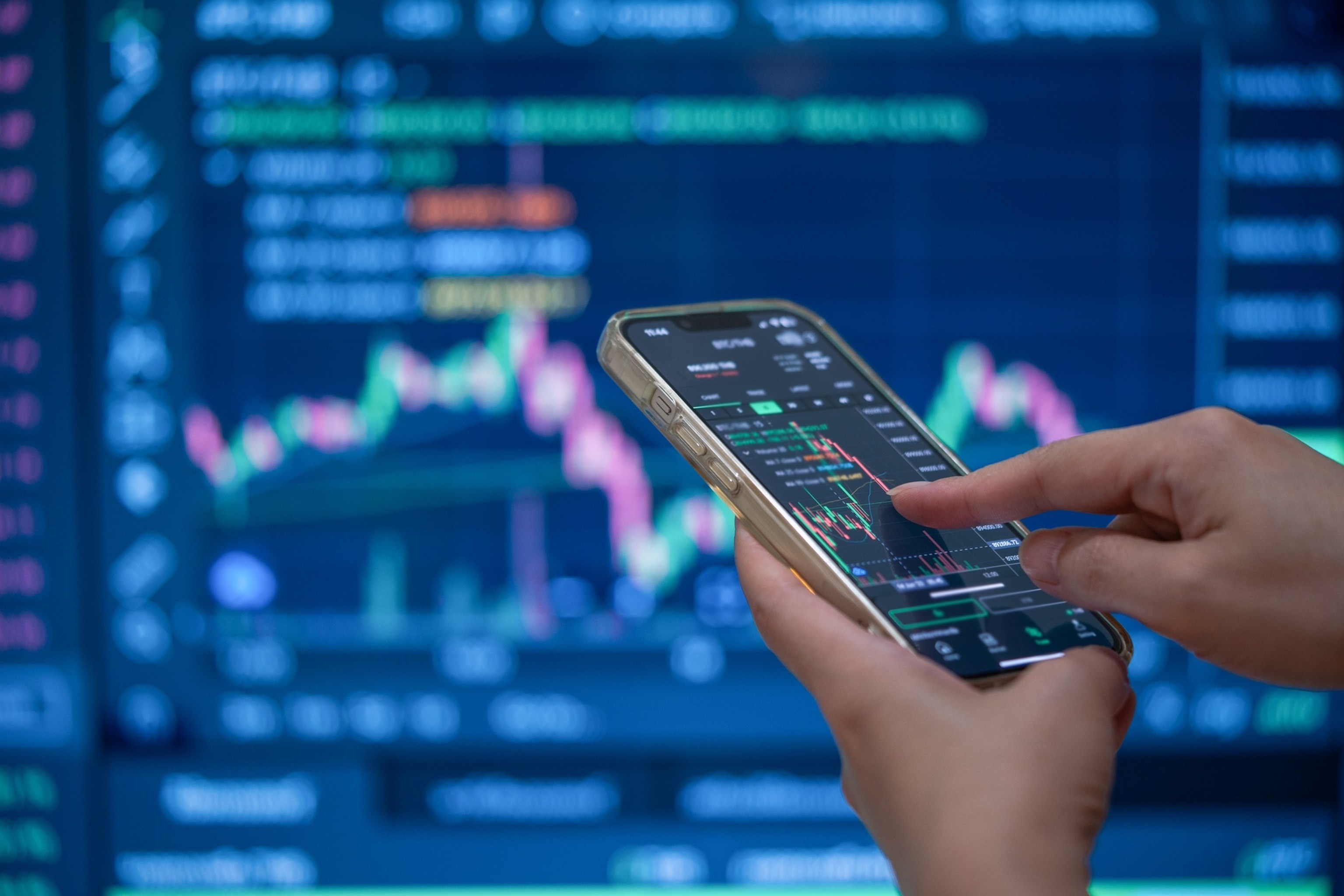 Online stock trading on mobile.Manusapon Kasosod/Getty Images