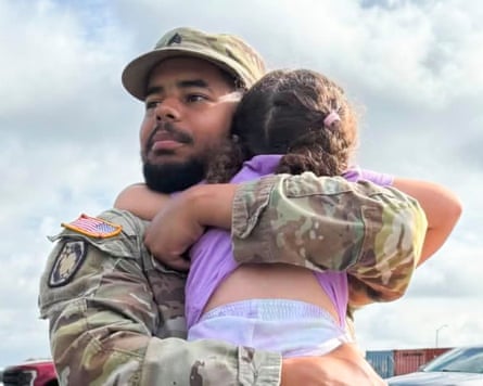 Sgt Michael Emmanuel Swinton with his daughter.Photograph: Courtesy Mia Gonzalez-Swinton