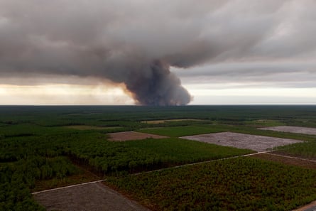 Smoke rising from the wildfire in Saumos is photographed from Arès on Wednesday.Photograph: Romain Perrocheau/AFP/Getty Images