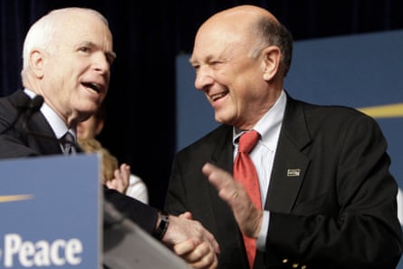 John McCain, left, shakes hands with R James Woolsey at a campaign event at Fresno State in Fresno, California, on 23 June 2008.Photograph: LM Otero/AP