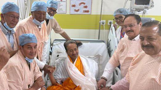 Image caption,Wangchuk (centre) ended his fast last night in the presence of federal ministers