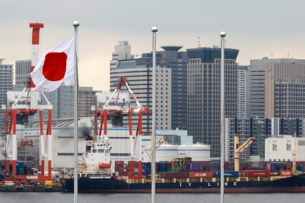 A container ship berths at a port in Tokyo.Photograph: Franck Robichon/EPA