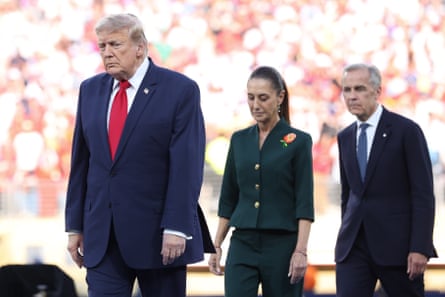 Donald Trump walks ahead of Mexico’s Claudia Sheinbaum and Canada’s Mark Carney at the World Cup final in East Rutherford, New Jersey, on 19 June.Photograph: Alex Livesey/Danehouse/Getty Images