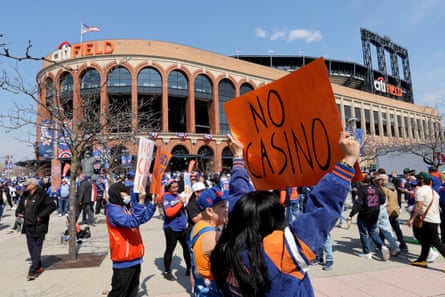 Protesters in front of Citi Field demonstrate against New York Mets owner Steve Cohen’s proposed casino on 26 March 2026.Photograph: Brad Penner/Imagn Images/Reuters Connect