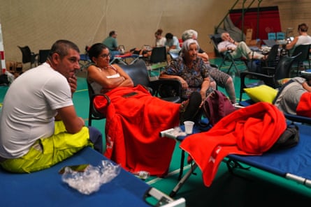 People spend the night at a sports centre after being evacuated from their homes in Cebreros, Ávila province.Photograph: Manu Fernández/AP