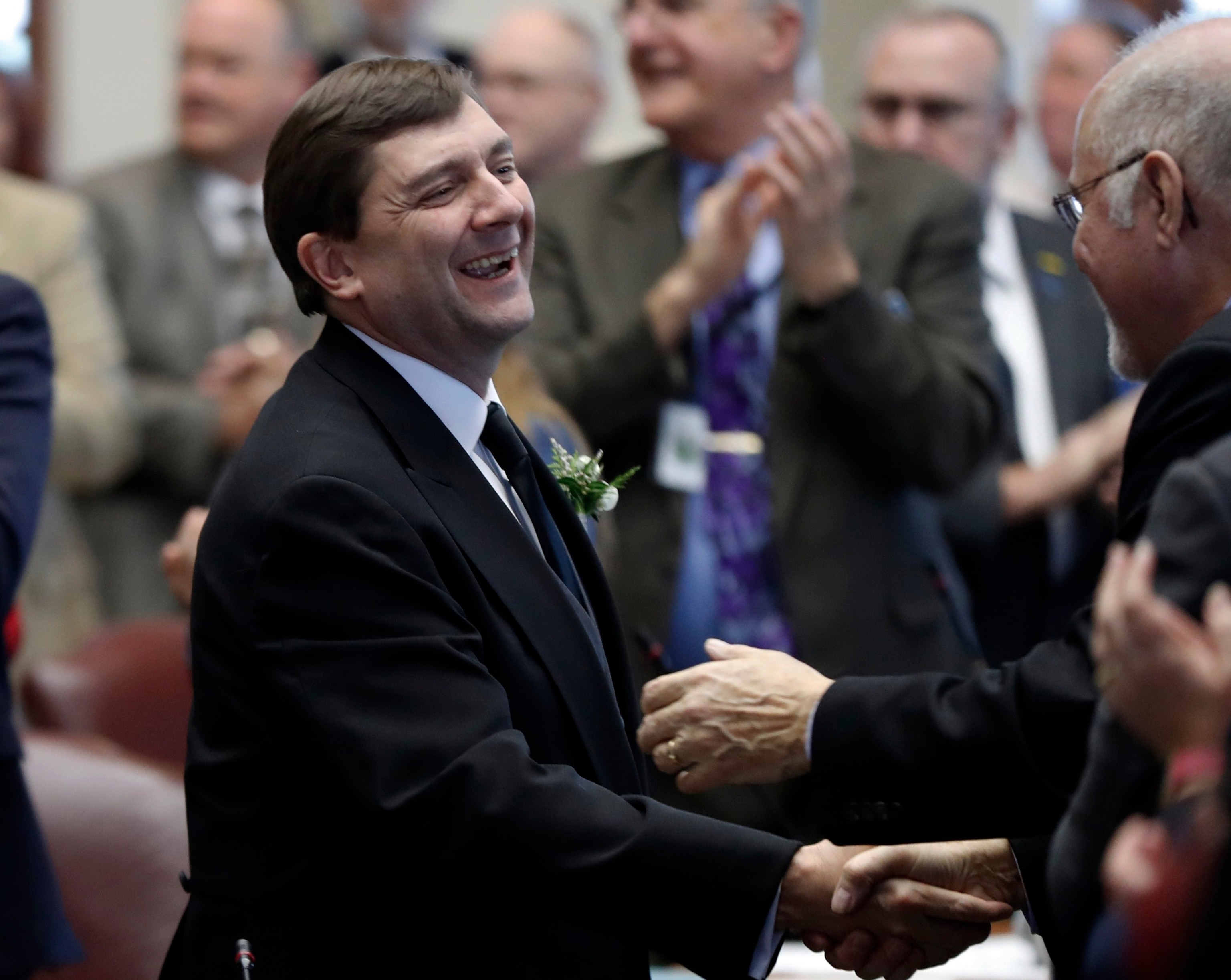 Senate President Troy Jackson is greeted by lawmakers as he arrives for joint session in the House Chamber, Dec., 5, 2018, at the State House in Augusta, Maine.Robert F. Bukaty/AP Photo