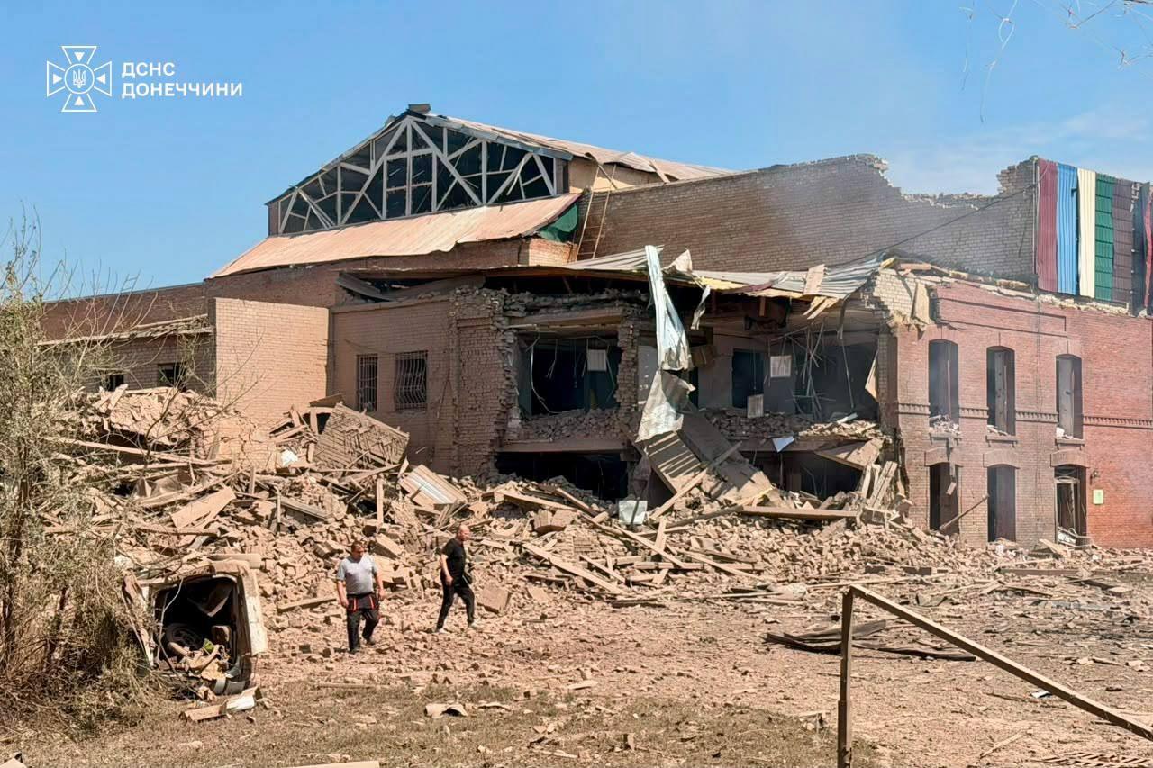 Image caption,The scene of a Russian missile strike just outside of Kyiv where six people were killed and dozens injured on Friday