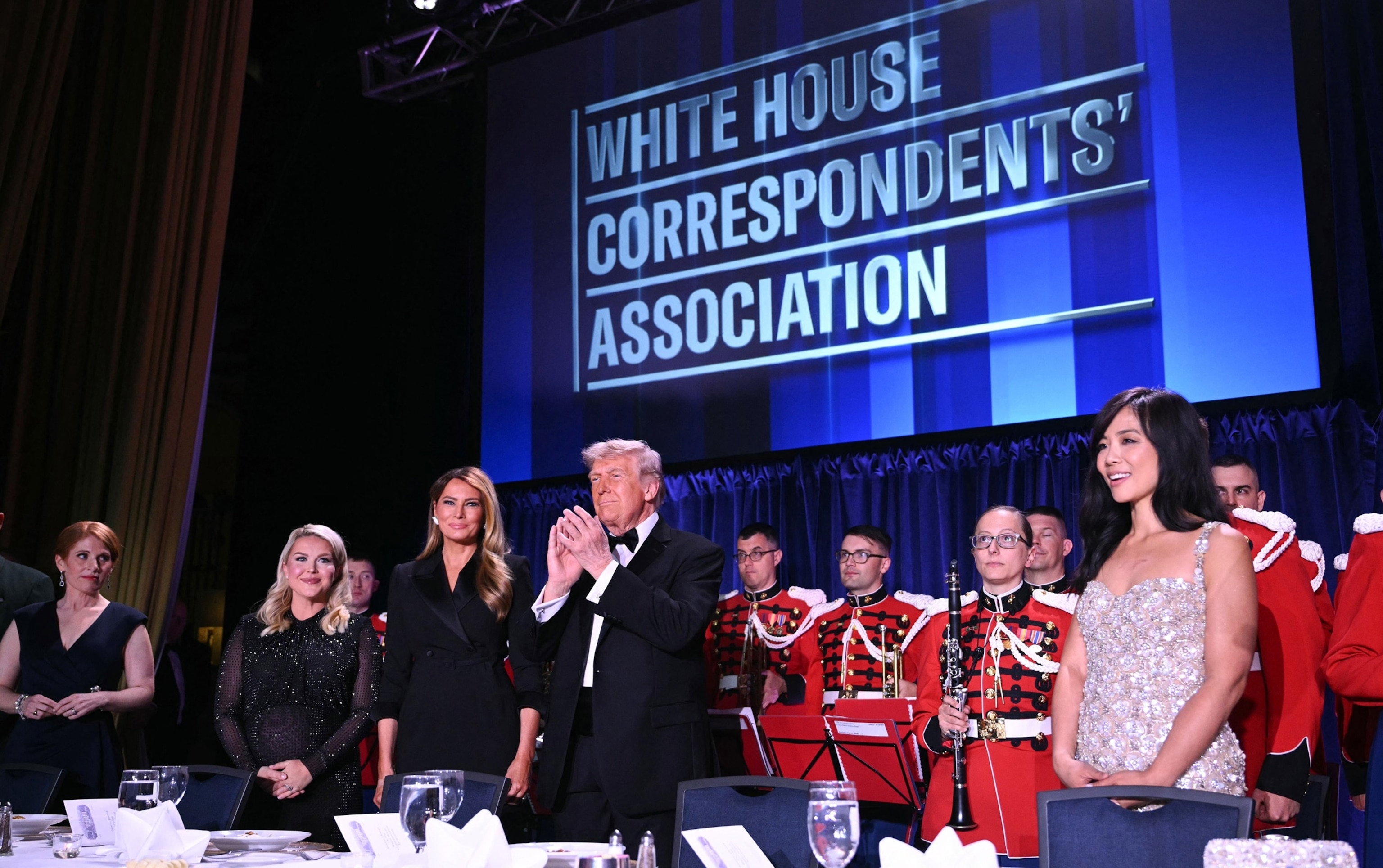 In this April 25, 2026, file photo, journalist Karen Travers, White House Press Secretary Karoline Leavitt, First Lady Melania Trump, President Donald Trump and CBS News senior White House correspondent Weijia Jiang attend the White House Correspondents' dinner at the Washington Hilton in Washington, D.C.Mandel Ngan/AFP via Getty Images, FILE
