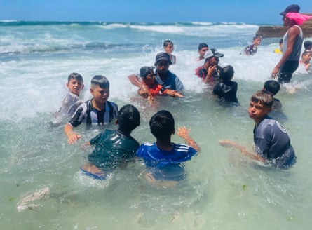 Children take part in a swimming class