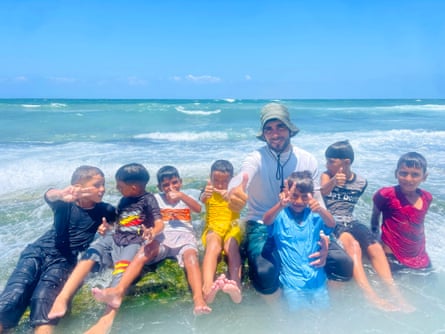 Instructor Ali Al-Attar with a group of the children