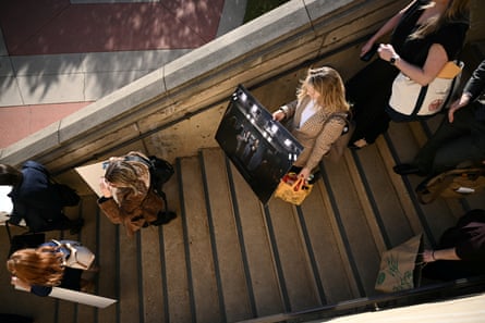Reporters carry their belongings from the Pentagon in Arlington, Virginia, on 15 October 2025, after news outlets declined to sign restrictive media rules and were stripped of their access credentials.Photograph: Brendan Smialowski/AFP/Getty Images