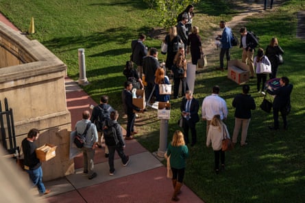 Reporters walk out of the Pentagon together on 15 October 2025.Photograph: The Washington Post/Getty Images
