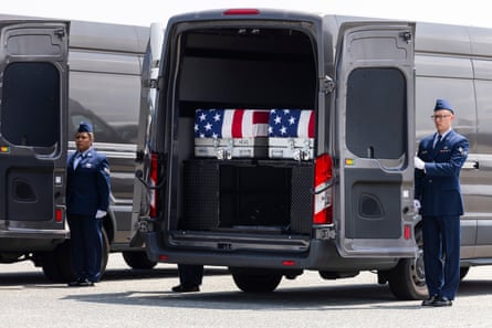 The remains of Staff Sgt Michael Emmanuel Swinton (center left) and 1st Lt Tyler James Feehan during a dignified transfer at Dover air force base in Dover, Delaware, on 22 July 2026.Photograph: Jim Lo Scalzo/EPA