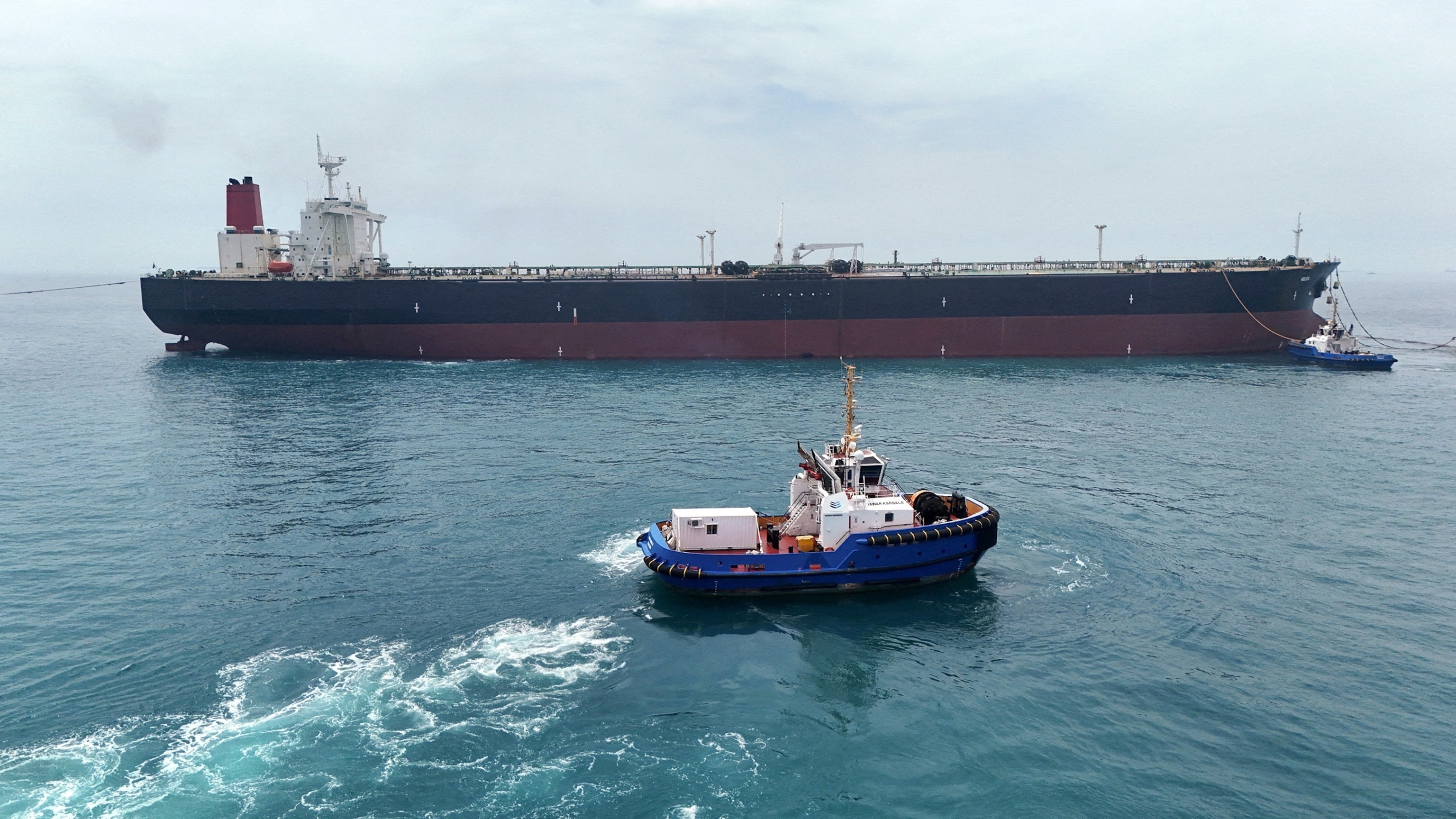 In this April 24, 2026, file photo, an oil tanker HELGA berthed at one of Iraq's southern offshore oil terminals near Basra as it prepares to load crude oil, becoming the second vessel to arrive since the closure of the Strait of Hormuz.Mohammed Aty/Reuters, FILE