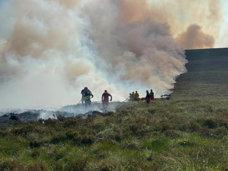 Firefighters tackling a major wildfire, which started in heathland near Glenmore.Photograph: RSPB Scotland/PA