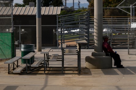 A man rests in the shade in Los Angeles on 20 July 2026.Photograph: Chris Torres/EPA