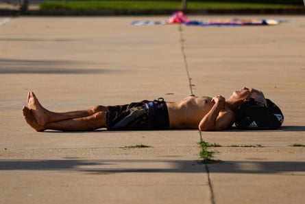 Lying by the pool in Los Angeles on 20 July 2026.Photograph: Chris Torres/EPA