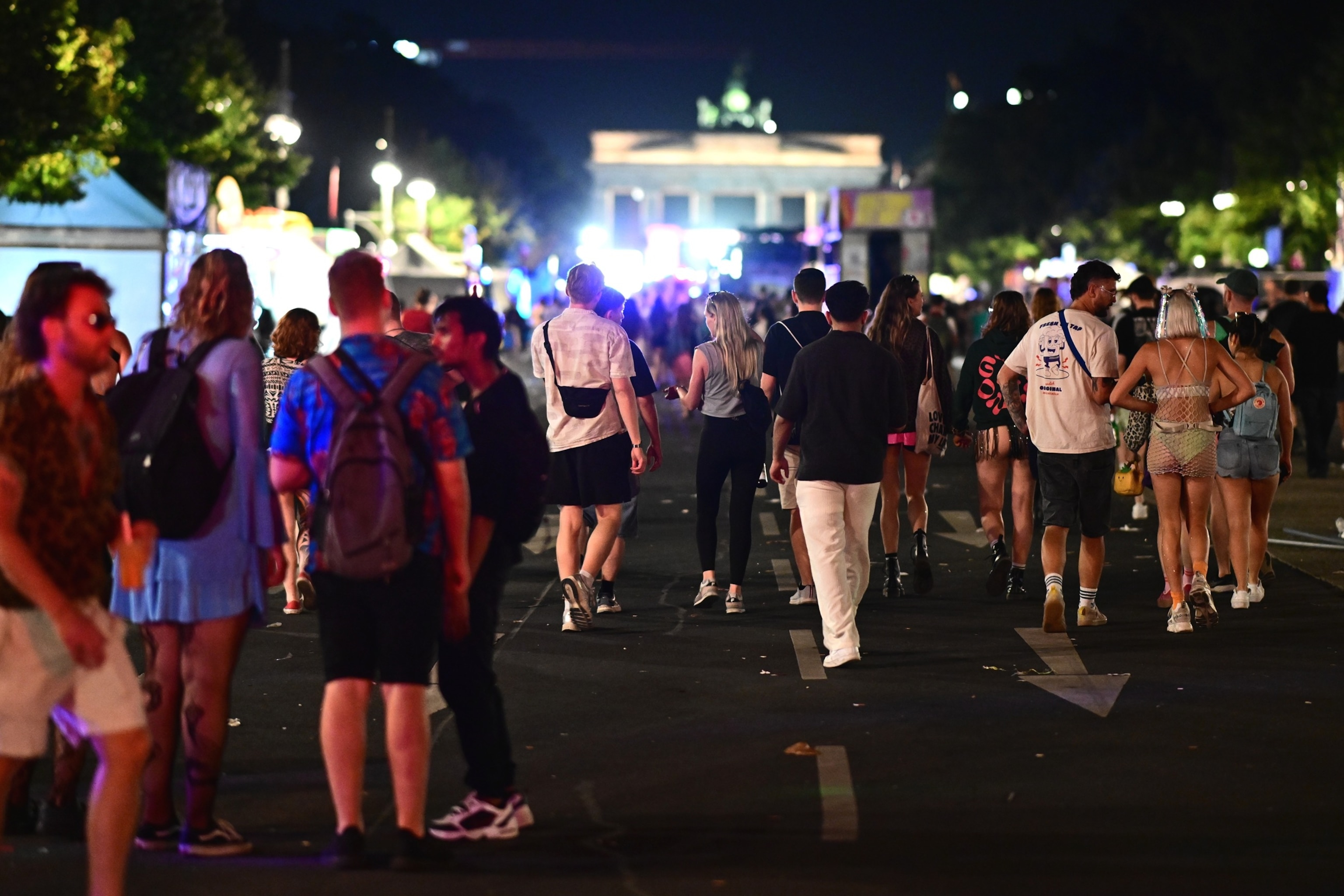 People stand on 17 June Street following the cancellation of Christopher Street Day in Berlin, on Saturday, July 25, 2026.Fabian Sommer/DPA via AP