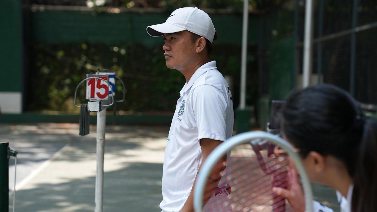 Image caption,Tennis coach Jovy Barce took the difficult path to the sport