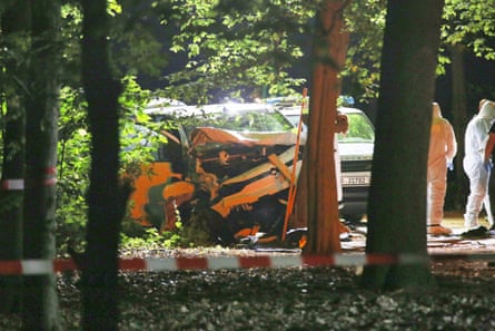 Forensic investigators collect evidence from the white van involved at the crime scene.Photograph: dts News Agency Germany/Shutterstock