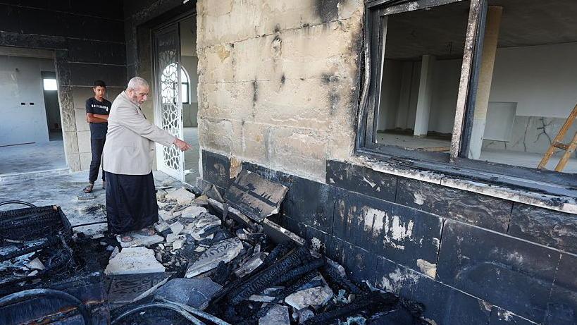 Image caption,A mosque in the village of Qusra was reportedly targeted by settlers overnight