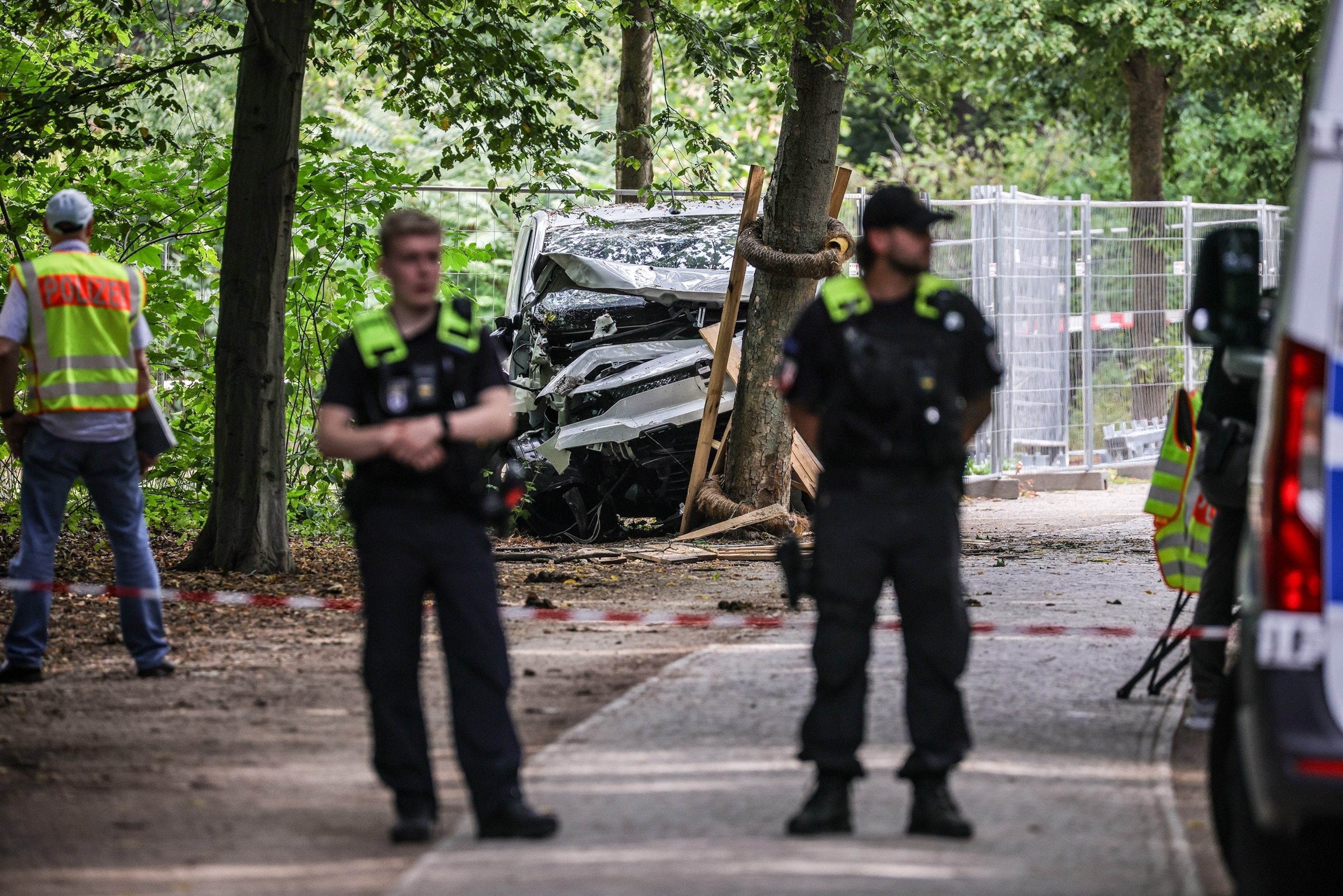 German police stand near a white van that suspect Abdul B. allegedly used in last night's vehicle crash during the Christopher Street Day Berlin pride parade on July 26, 2026 in Berlin, Germany.Omer Messinger/Getty Images